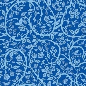 Blue color themed statement print - garden , flowers, branches, vines  and wildlife .
