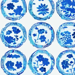 Blue and white plates on white background