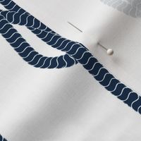 Coastal chic Deep blue rope and sailor's knots on a white background