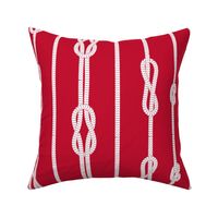 White rope and sailor's knots pattern on red background