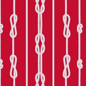 White rope and sailor's knots pattern on red background