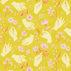 Hands holding flowers yellow and pink