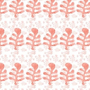 Cut out monoprinted patterned tossed leaves and striped leaves in pale salmon and coral  hues  colours 6” repeat 