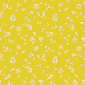 Small pansy flowers on a bright yellow background.