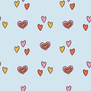 Colorful Hand Drawn Retro Groovy Love Heart Shapes in Blue Background