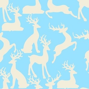 Lilght blue jumping and sitting reindeer for preppy christmas table fabric and wallpaper