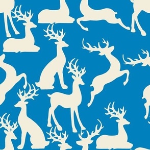 Cobalt blue jumping and sitting reindeer for preppy christmas table fabric and wallpaper