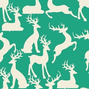 Jade green jumping and sitting reindeer for preppy christmas table fabric and wallpaper