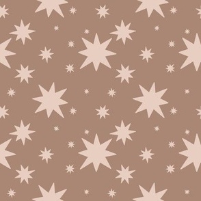 Cocoa stars on coffee background