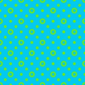 Green rings and dots on a bright blue background