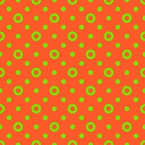 Green rings and dots on a bright orange background