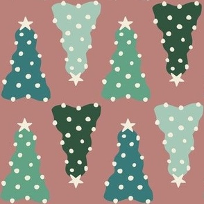 Blue and green preppy christmas trees with white trims on a dusty pink background