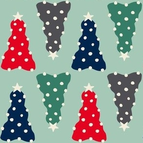 Red, navy, green and red preppy christmas trees with white trims on a jadeite green background