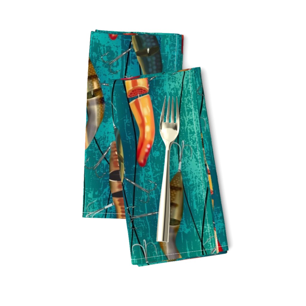 Antique Fishing Lures on fishing line on a bright teal green textured backdrop