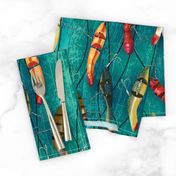 Antique Fishing Lures on fishing line on a bright teal green textured backdrop