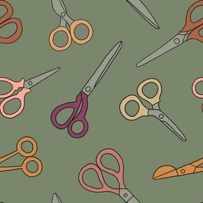 Scissors for sewing on green background