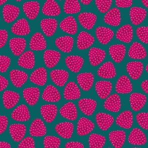 tossed raspberries on dark green | large