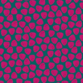 tossed raspberries on dark green | medium