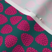 tossed raspberries on dark green | small