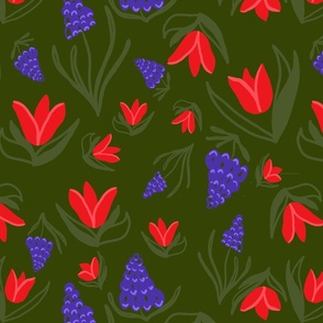 Red Tulips and Muscari Flowers on Green