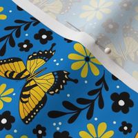 Medium Scale Golden Yellow Tiger Swallowtail Butterflies on Blue