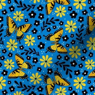 Medium Scale Golden Yellow Tiger Swallowtail Butterflies on Blue