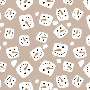 Floating snowmen smiley marshmallows  on latte coffee