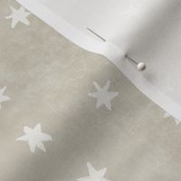 Garden of tiny warm white stars on taupe texture (2/3 inch stars)