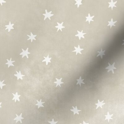 Garden of tiny warm white stars on taupe texture (2/3 inch stars)