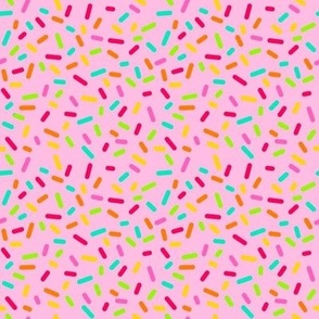 Smaller Scale Candy Rainbow Confetti Sprinkles on Pink