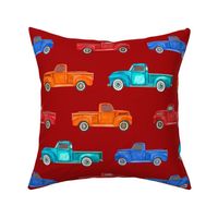 Large Scale Colorful Vintage Trucks  on Dark Red