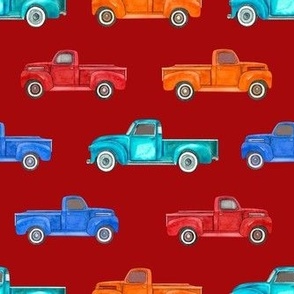 Medium Scale Colorful Vintage Trucks  on Dark Red