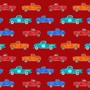 Small Scale Colorful Vintage Trucks  on Dark Red