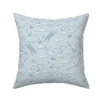 beach with kites, shells and birds on light blue | medium