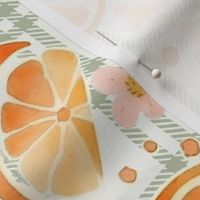 14" whimsical cute abstract and hand painted orange and lime pattern with flowers and leaves on a green/white grid