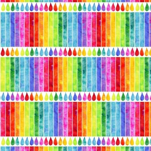watercolor rainbow candles in a row