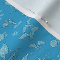 beach with kites, shells and birds on brilliant blue | tiny