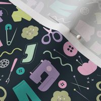 DIY fashion design - sewing icons and hand made clothes buttons scissors and thread and needles pink teal mint lilac on deep navy blue