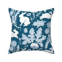 rabbits in the vegetable garden white and blue | medium