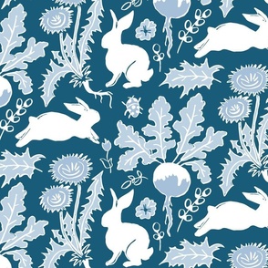 rabbits in the vegetable garden white and blue | medium