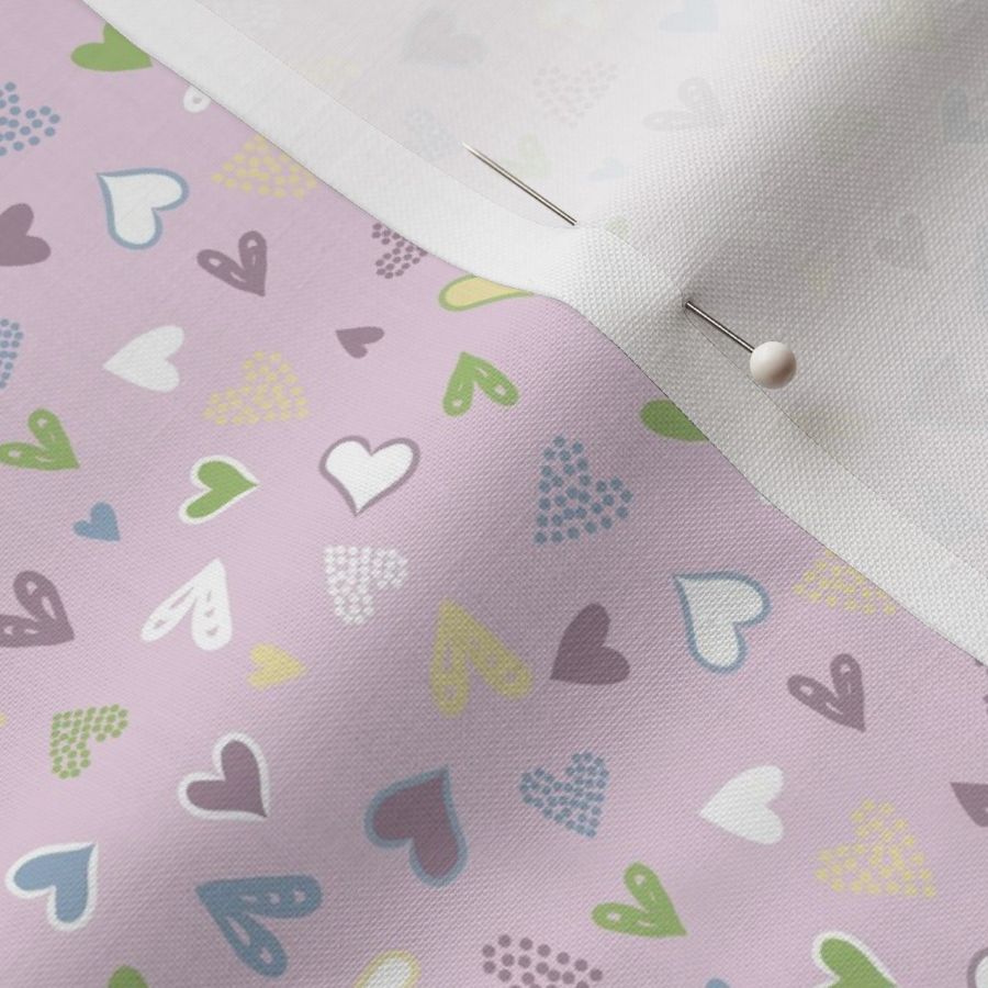 Bright colourful love hearts scattered on lilac purple - mini