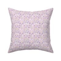 Bright colourful love hearts scattered on lilac purple - mini