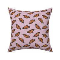 Small monarch butterflies on a lilac purple base, watercolor butterflies perfect for kids apparel and nursery