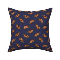 Small monarch butterflies on a navy blue base, watercolor butterflies perfect for kids apparel and nursery