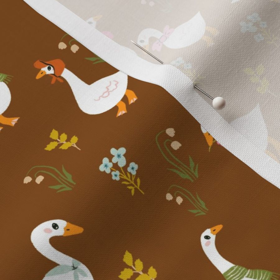 Goose wearing Colorful Scarfs in Brown Background