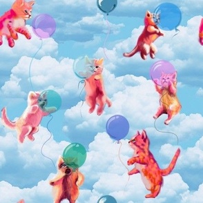 kittens and balloons in a blue sky