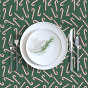 candy canes on dark green