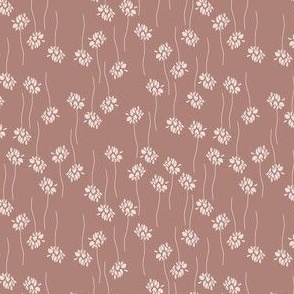 white flowers and twigs in lines on marsala red