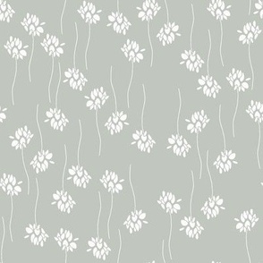 white flowers and twigs in lines on light gray