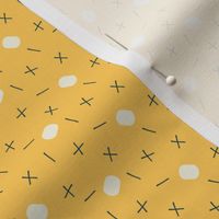 Scattered geometric beige and navy lines, and shapes on yellow 